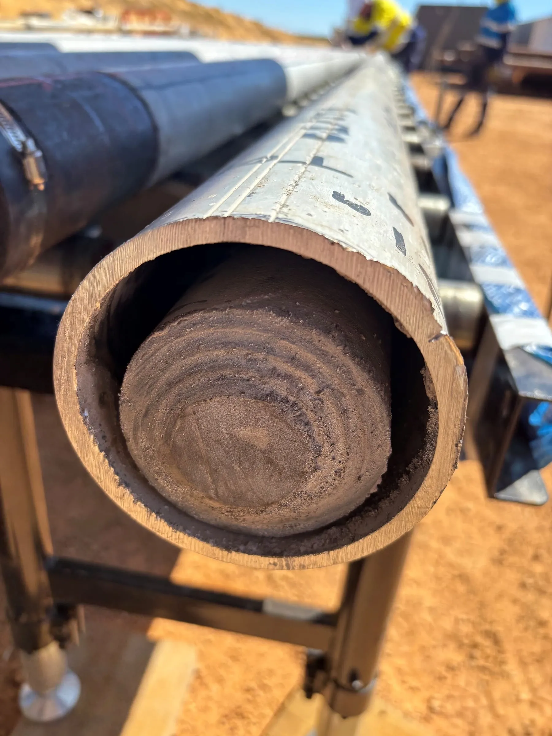 Close-up of the exposed core face in the end of an inner barrel, showing fine banding