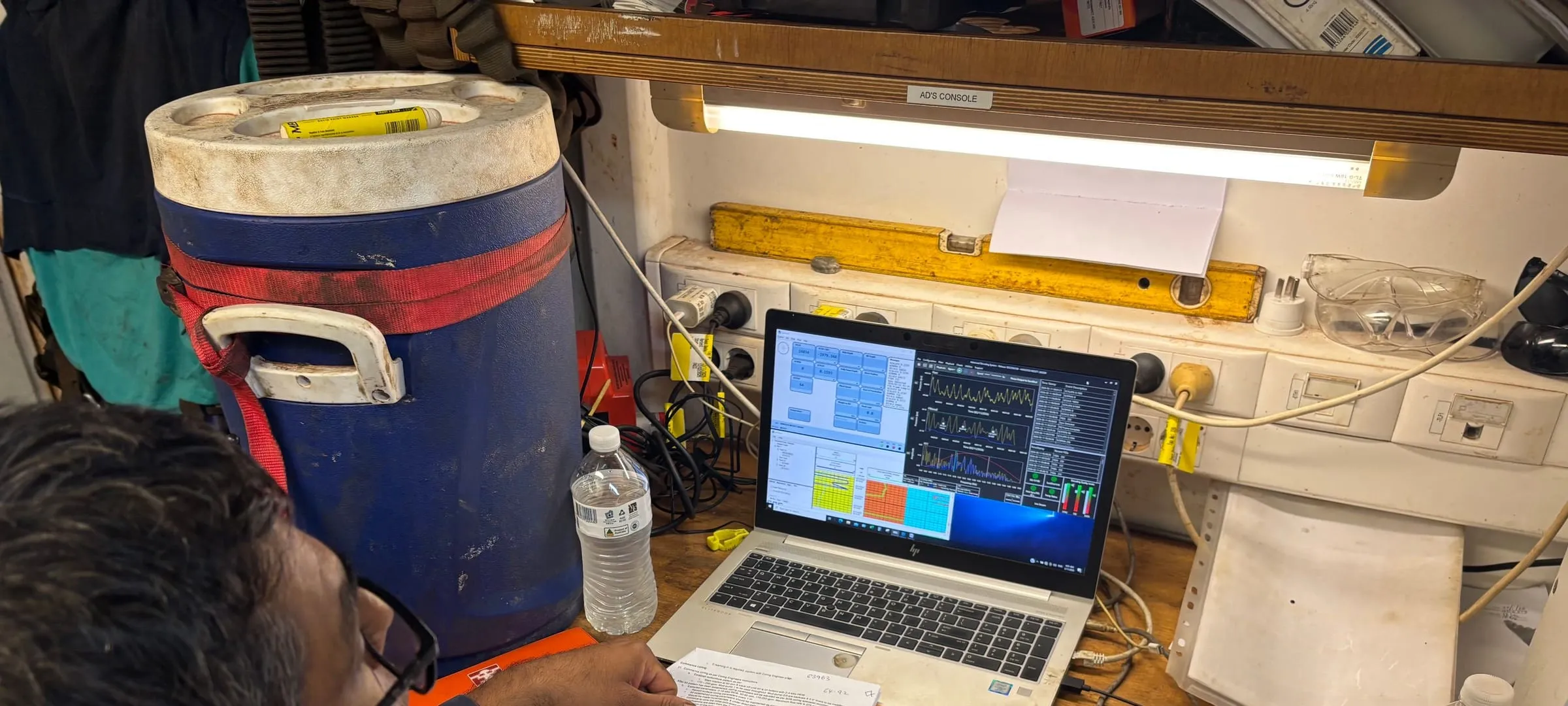 Coring engineer watching the live SureCore display on a laptop at the wellsite console