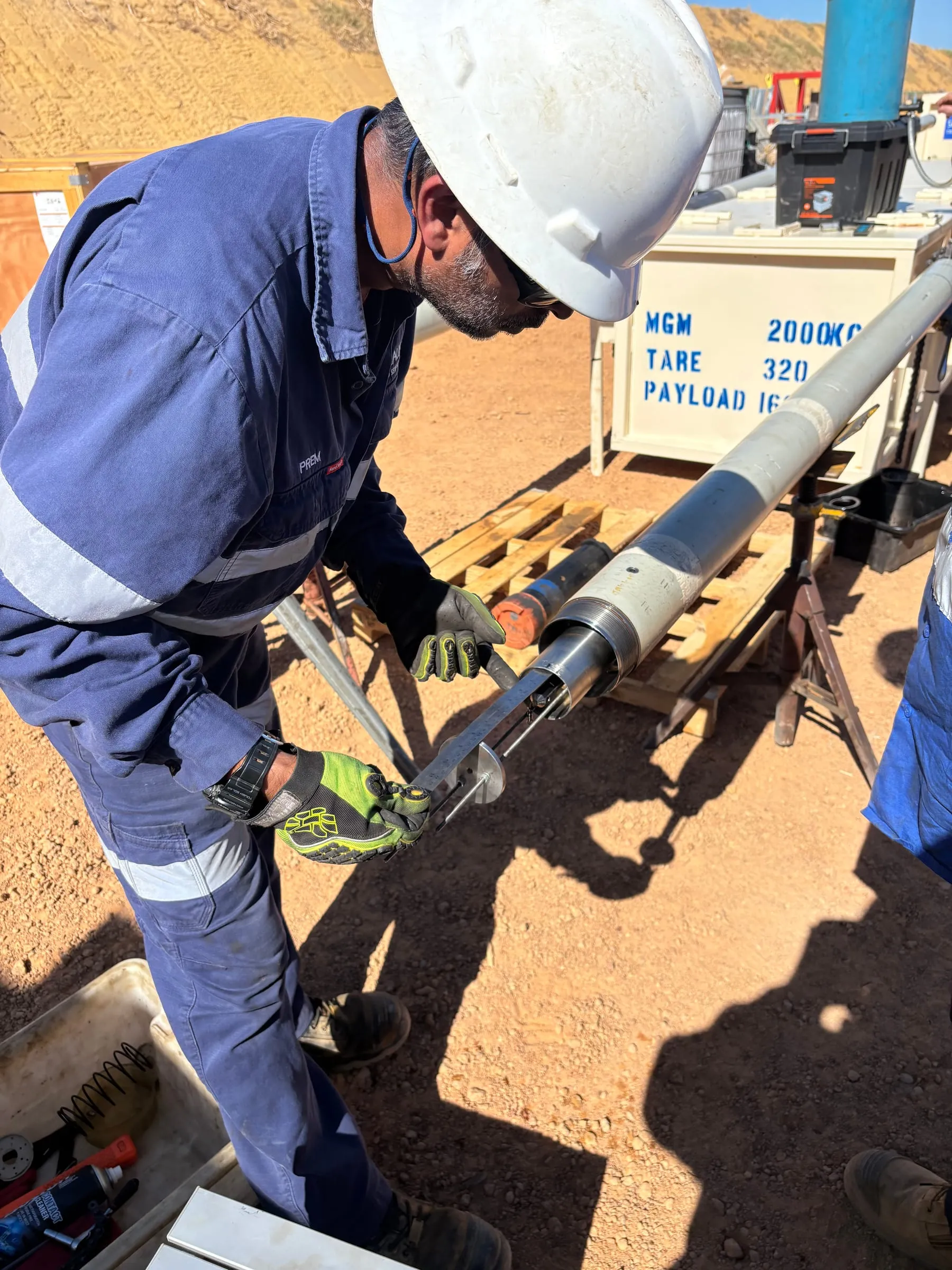 Engineer working on the SureCore tool compensator set-up at the wellsite
